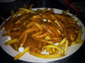Poutine - Fries Topped With Gravy and Cheesecurds