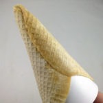 Forming the pizza crust into a cone