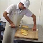 Slicing into some cheese at Uplands Cheese Company
