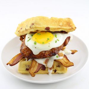 The Hickory Smoked Brown Sugar Boneless Pork Chop Waffle Breakfast Sandwich