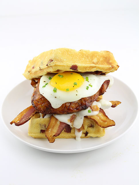 The Hickory Smoked Brown Sugar Boneless Pork Chop Waffle Breakfast Sandwich