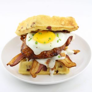 The Hickory Smoked Brown Sugar Boneless Pork Chop Waffle Breakfast Sandwich