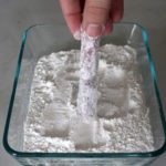 Coating the pork tenderloin in flour